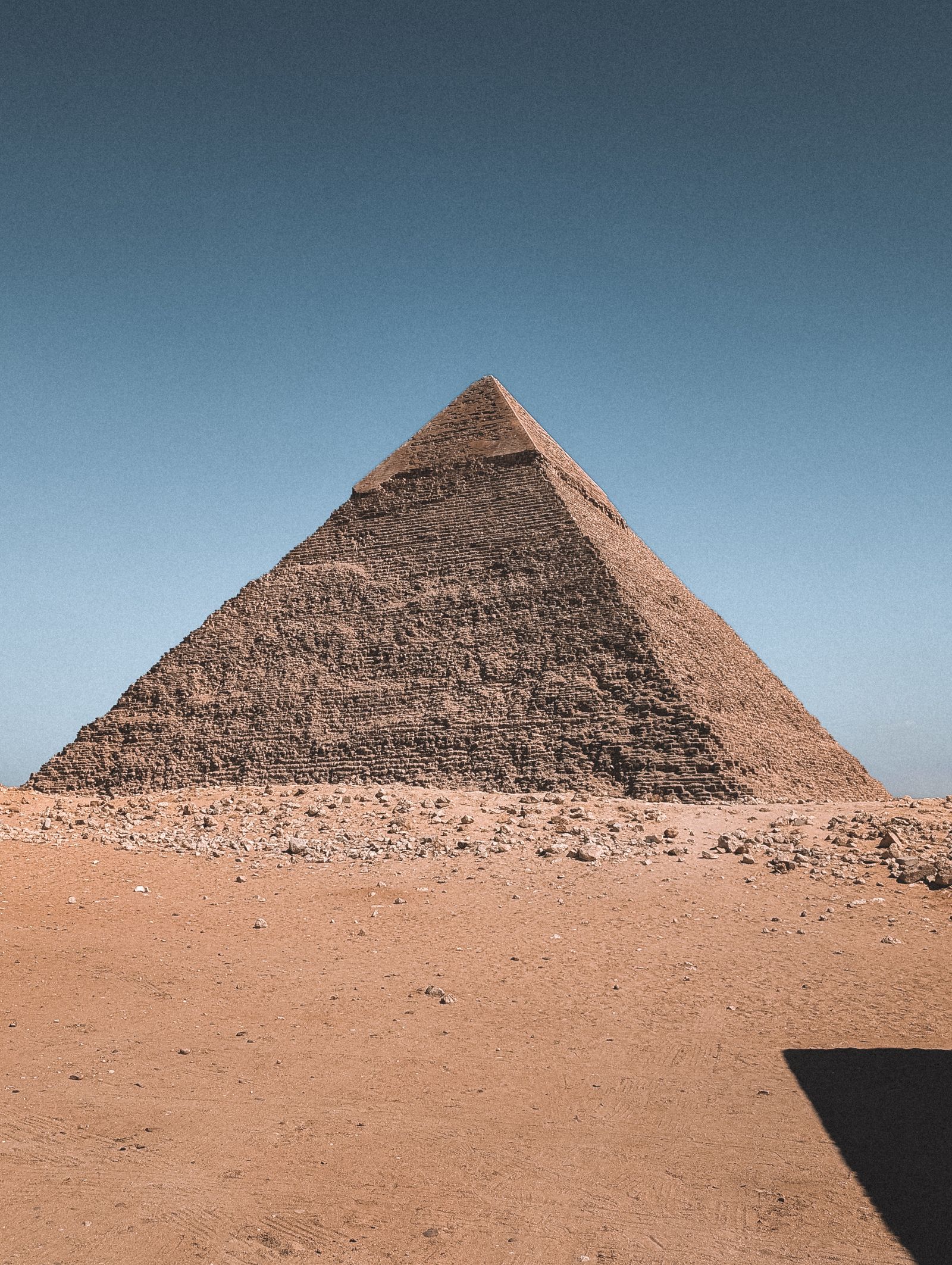 The Great Pyramid rising above the Giza plateau at daylight